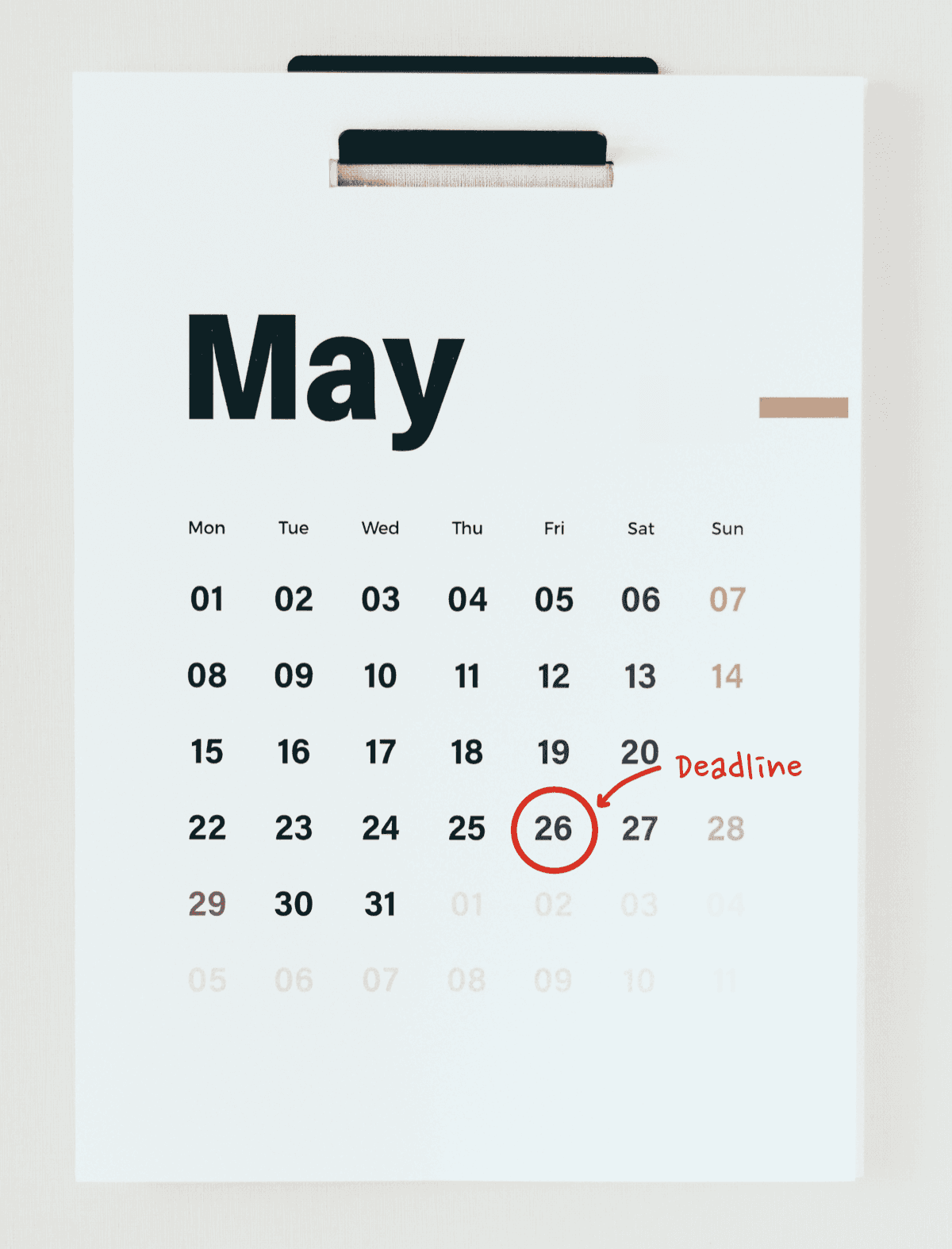 Wall calendar for May with the 26th circled as the deadline